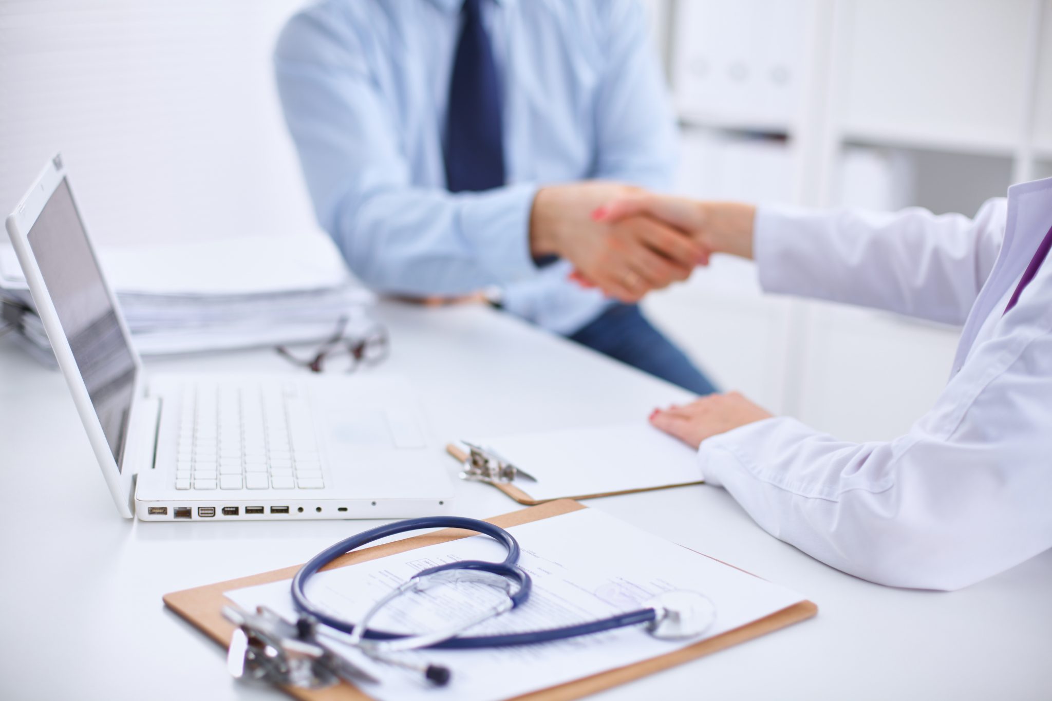 Doctor and Patient sitting at the desk