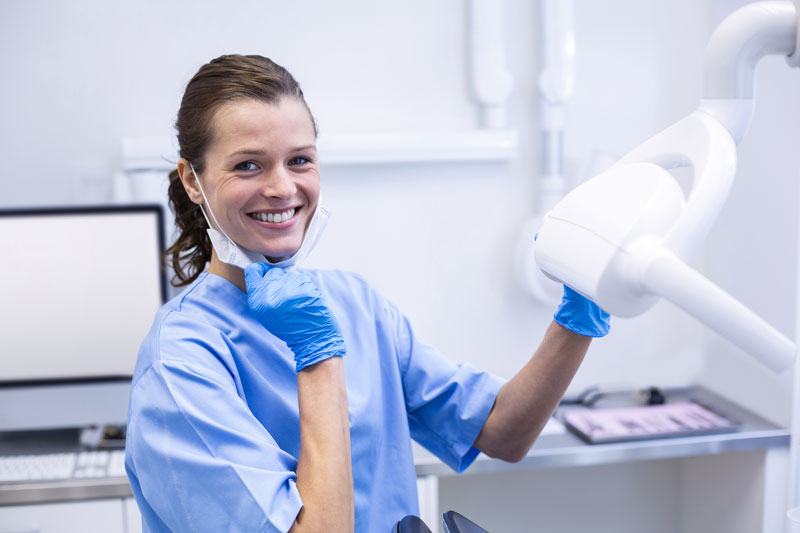 Female dentist smiling in her dental practice